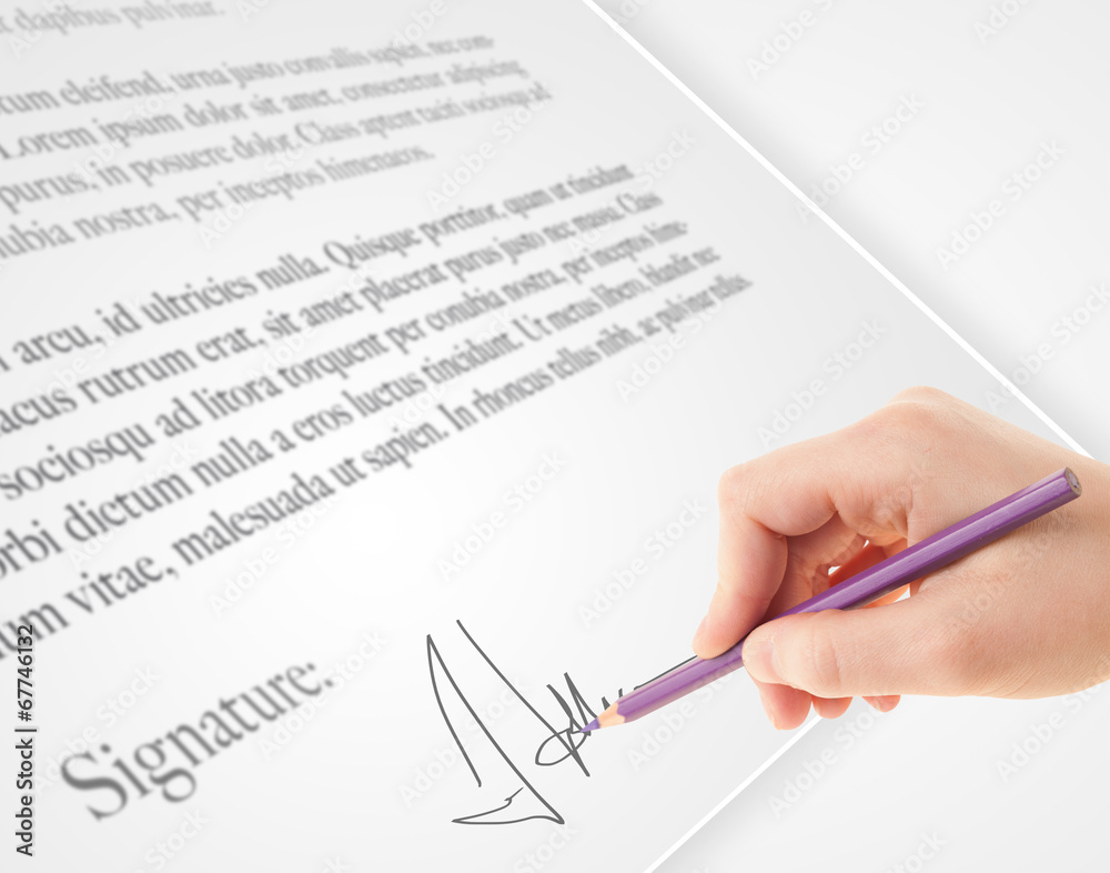 Hand writing personal signature on a paper form Hand writing personal signature on a paper form