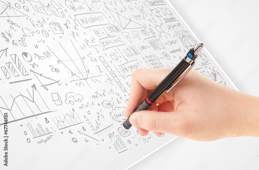 Human hand sketching ideas on a white paper Human hand sketching ideas on a white paper