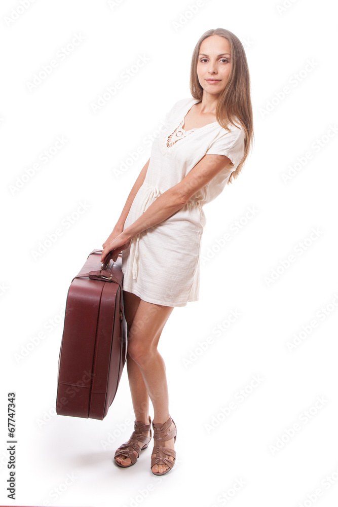 woman lifts a heavy suitcase, isolated on white woman lifts a heavy suitcase, isolated on white