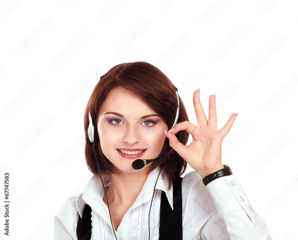 Smiling young customer service girl with a headset at her Smiling young customer service girl with a headset at her