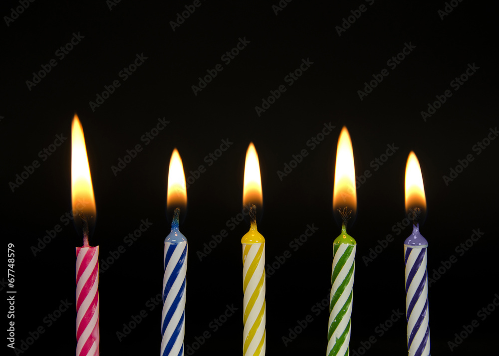 row of striped birthday candles row of striped birthday candles