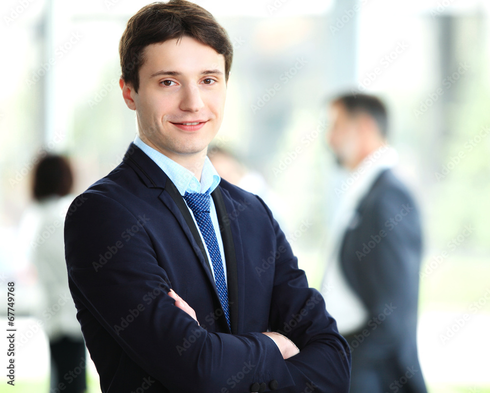 Happy smart business man with team mates discussing Happy smart business man with team mates discussing
