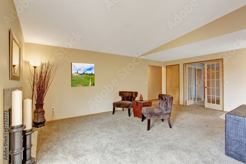 Empty living room in soft ivory with fireplace