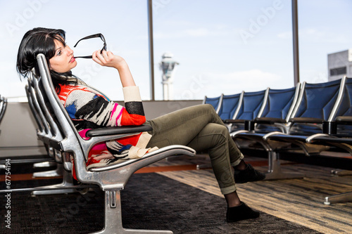Beautiful young brunette in airport