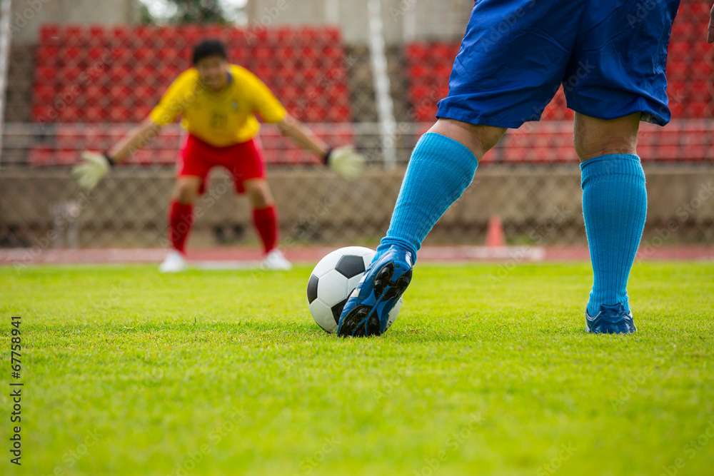 Attack soccer player shooting to defense team Attack soccer player shooting to defense team