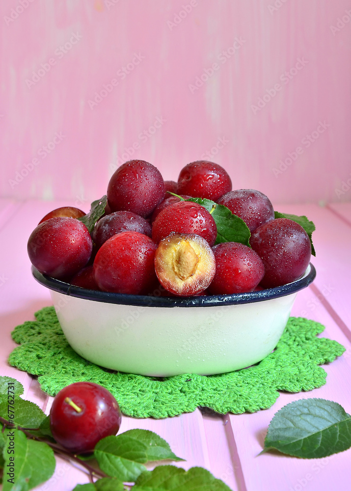 Plum in a white bowl. Plum in a white bowl.