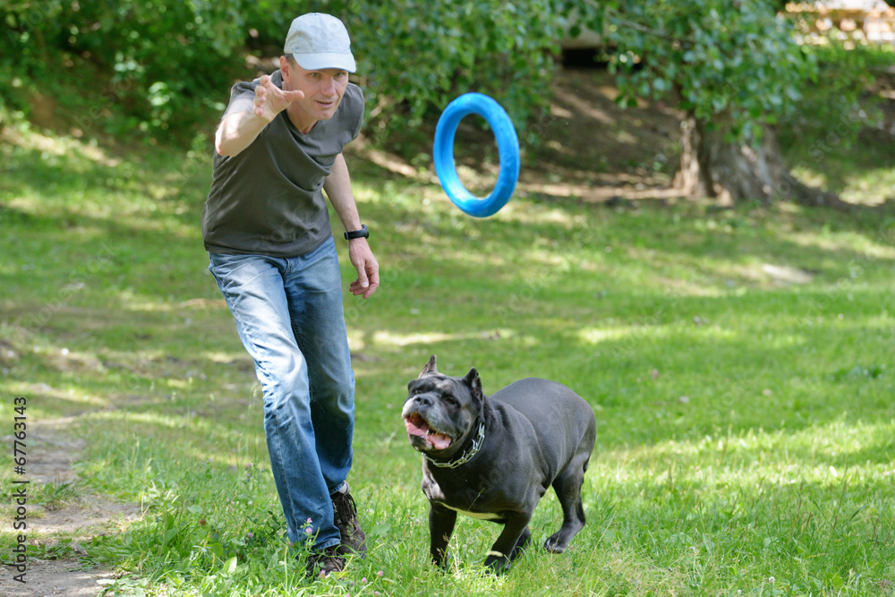 Man playing with his dog