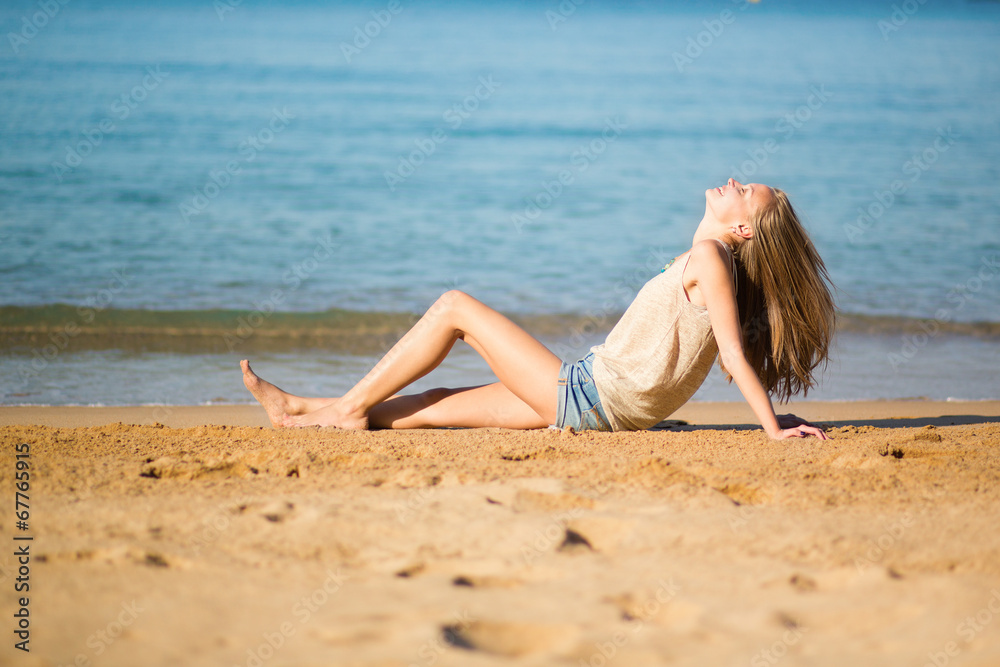 Young girl enjoying her vacation by the sea Young girl enjoying her vacation by the sea