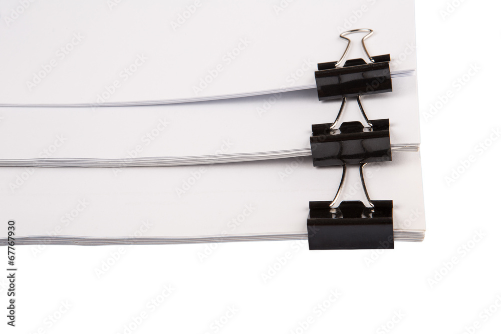 Binder clips with black white paper over white background Binder clips with black white paper over white background