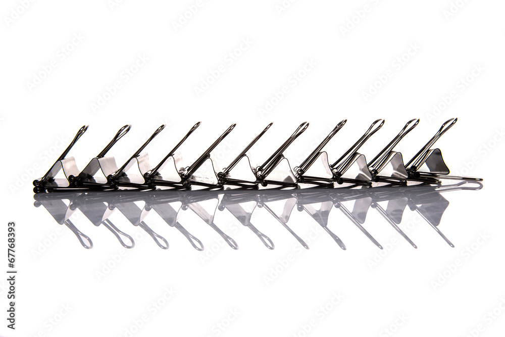 Binder clip over white background Binder clip over white background