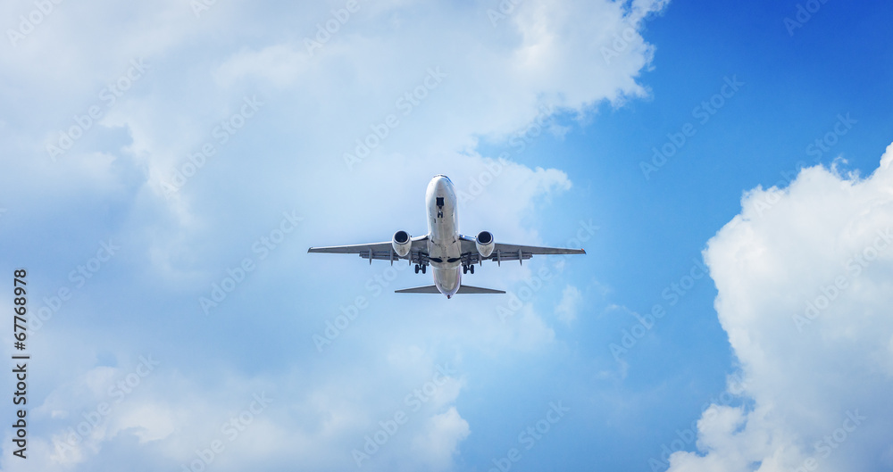 Passenger airplane flying in the blue sky