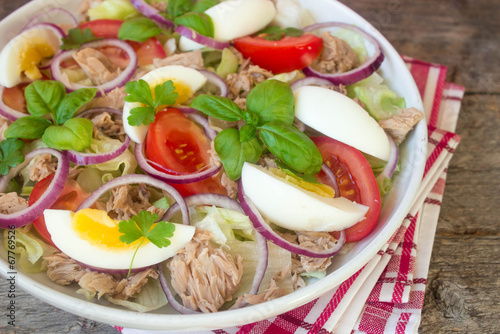 salad with tuna, eggs, tomatoes, onions and basil