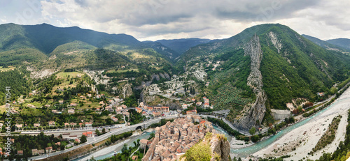 View on town Entrevaux, France. Mountains and blue river. photo