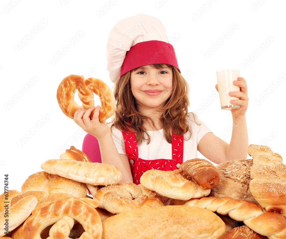 happy little girl cook with pretzel and glass of milk happy little girl cook with pretzel and glass of milk