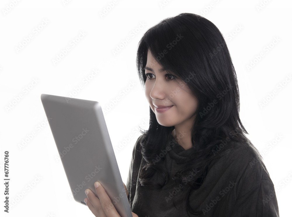 Fototapeta premium Beautiful woman using a digital tablet computer.