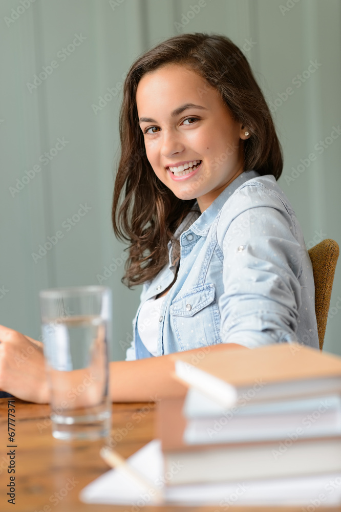 Smiling teenage girl student at home Smiling teenage girl student at home