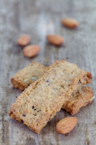 Close - up almond cookies on wood background