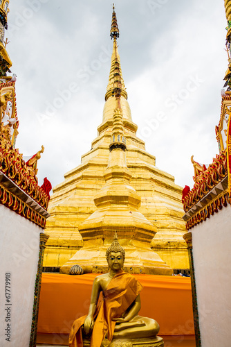 Ancient pagoda with buddha statue of Phra Borom Thad Bantak temp photo