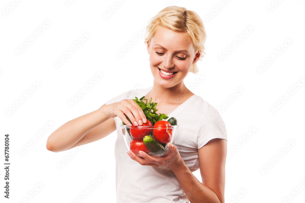 Close-up of happy healthy woman holding fresh vegetable salad in Close-up of happy healthy woman holding fresh vegetable salad in