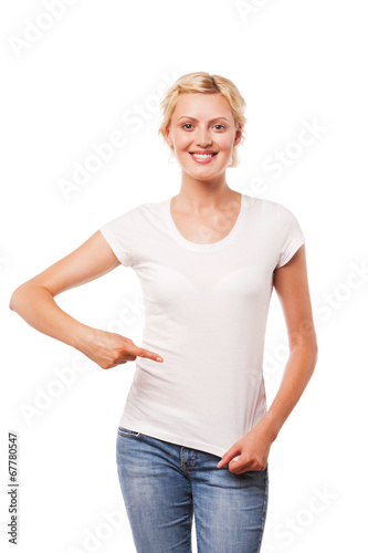 Smiling woman pointing at blank white t-shirt