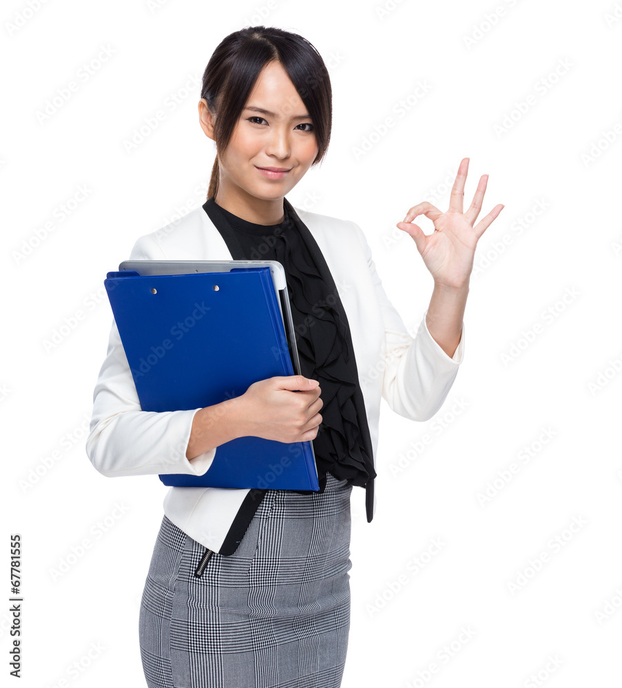 Asian business woman holding chip board with ok sign on white ba Asian business woman holding chip board with ok sign on white ba