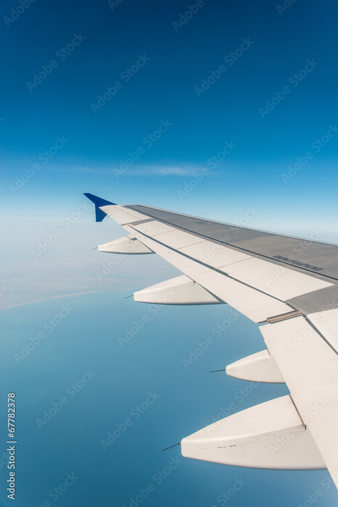 Fototapeta premium Airplane wing out of window