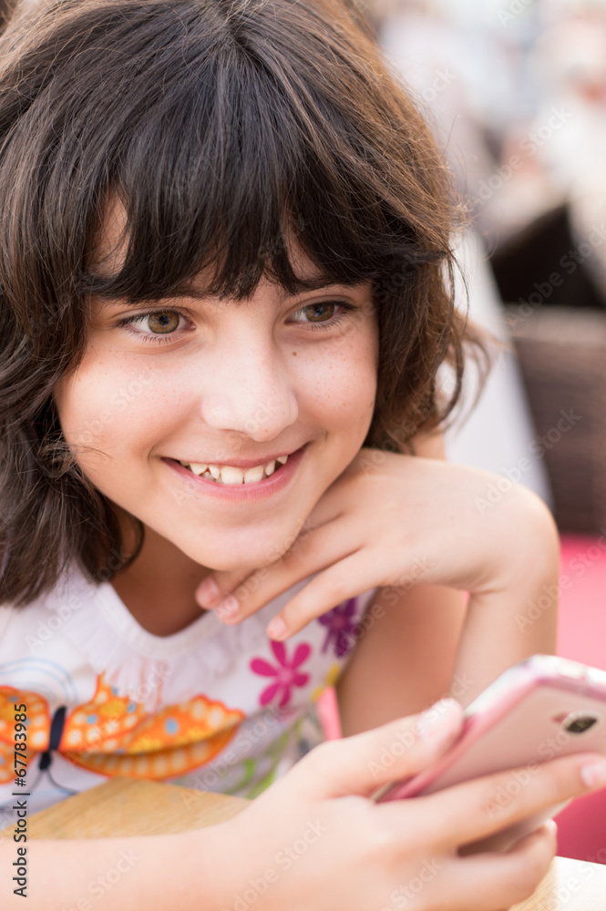 Girl with smartphone smiling