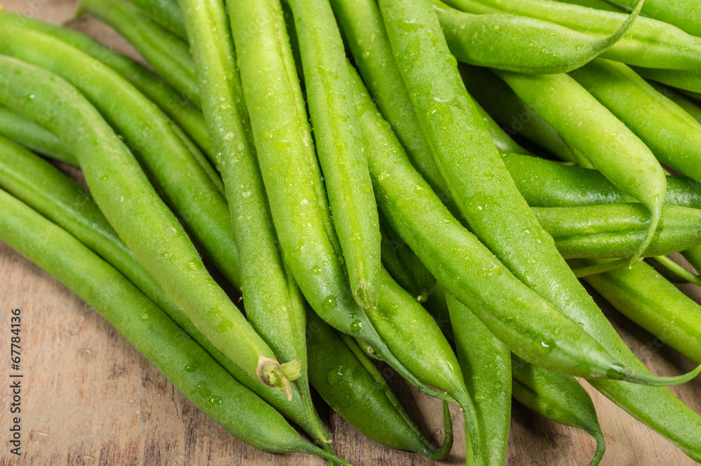 Fresh snap or green beans on a table Fresh snap or green beans on a table