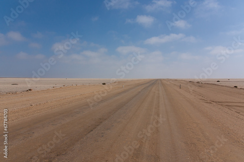Road between desert and ocean