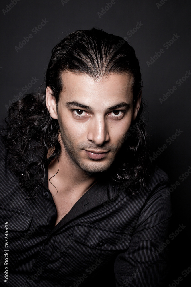 Portrait of young elegant man in the black shirt Portrait of young elegant man in the black shirt