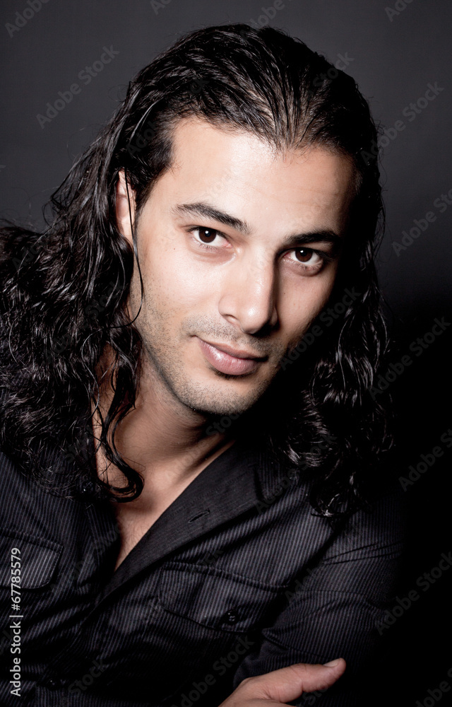 Portrait of young elegant man in the black shirt Portrait of young elegant man in the black shirt