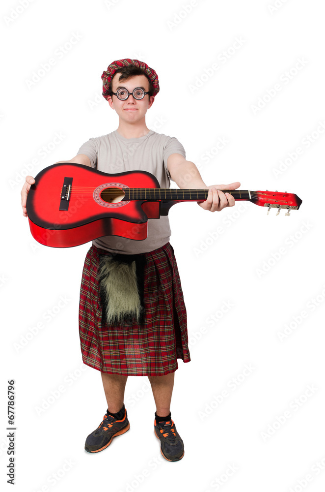 Scotsman playing guitar isolated on white Scotsman playing guitar isolated on white
