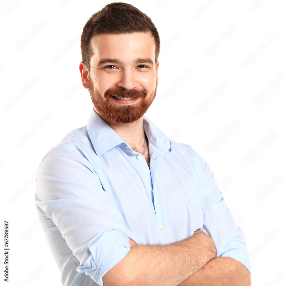 Casual young man looking at camera with arms crossed Casual young man looking at camera with arms crossed