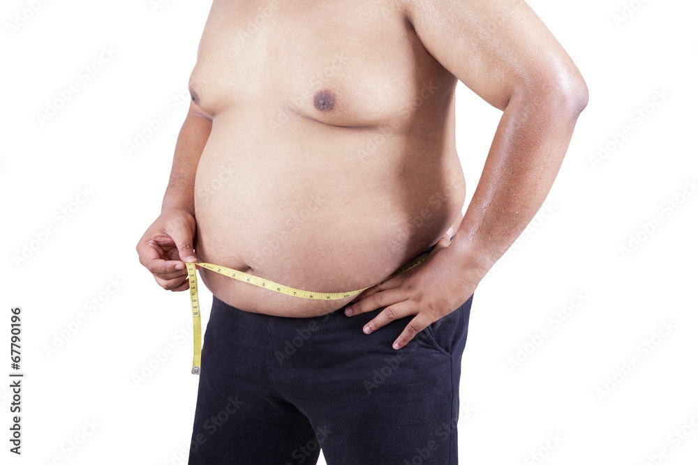 Naklejka premium Fat man measuring his stomach