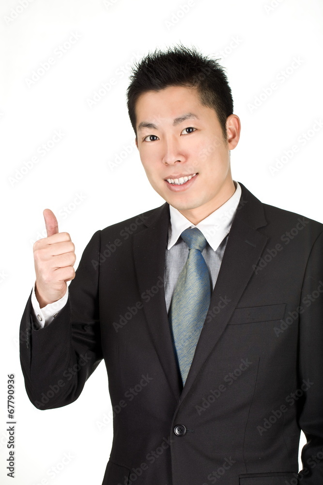 young asian business man lift his thumb to commend someone young asian business man lift his thumb to commend someone