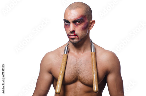 Man with nunchucks isolated on white