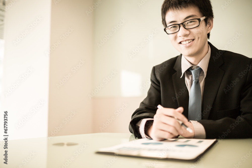 business report and man hand with pen