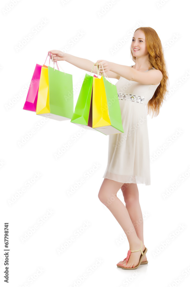 Woman after shopping spree on white