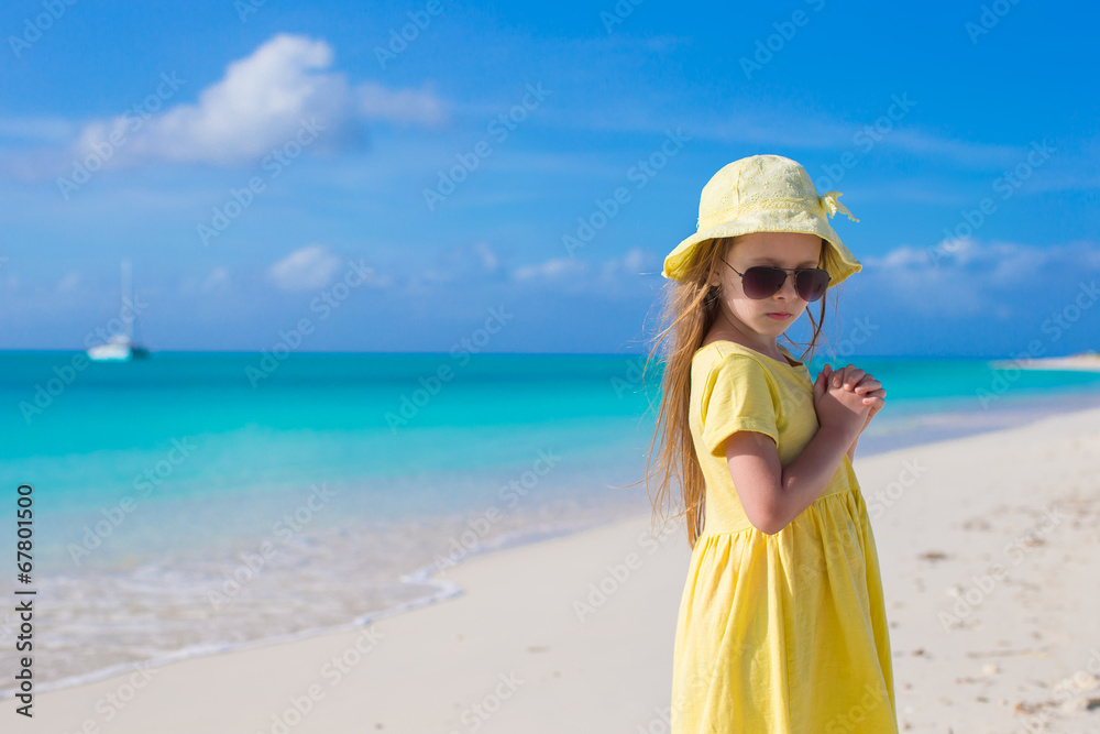 Adorable little girl at white beach during summer vacation Adorable little girl at white beach during summer vacation