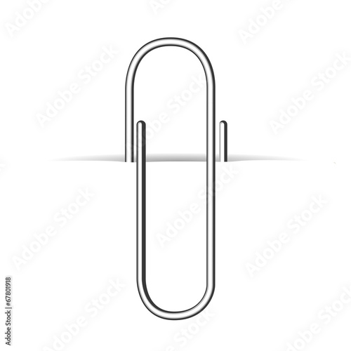Metal clip, paperclip on white paper