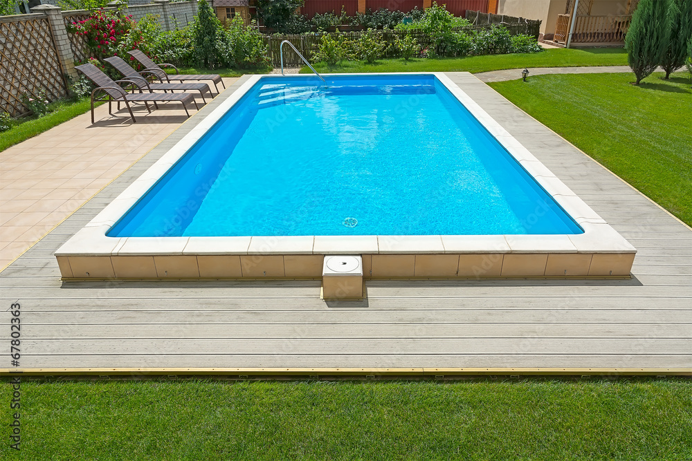 Fototapeta premium Swimming pool in the yard of a private home.