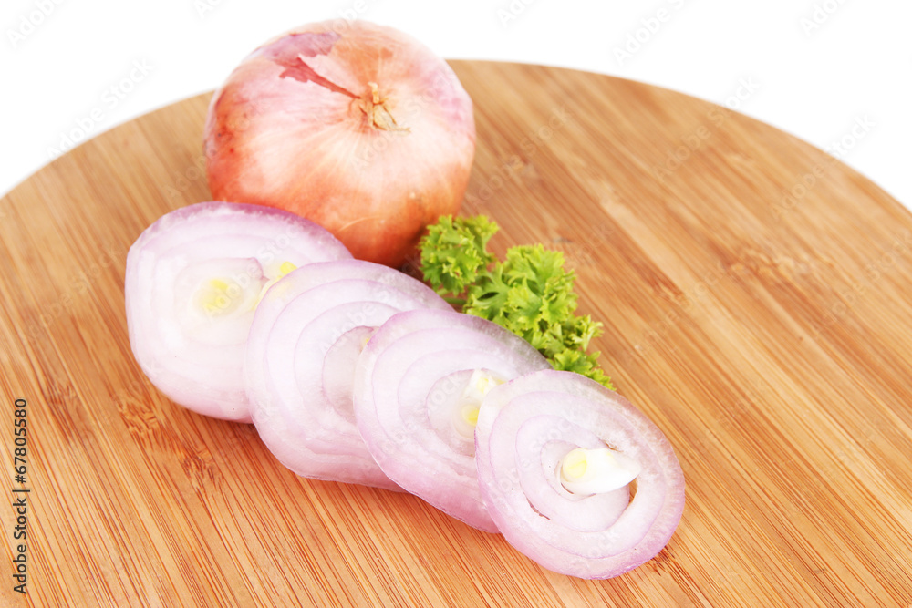 Onion cut with rings on wooden board isolated on white Onion cut with rings on wooden board isolated on white