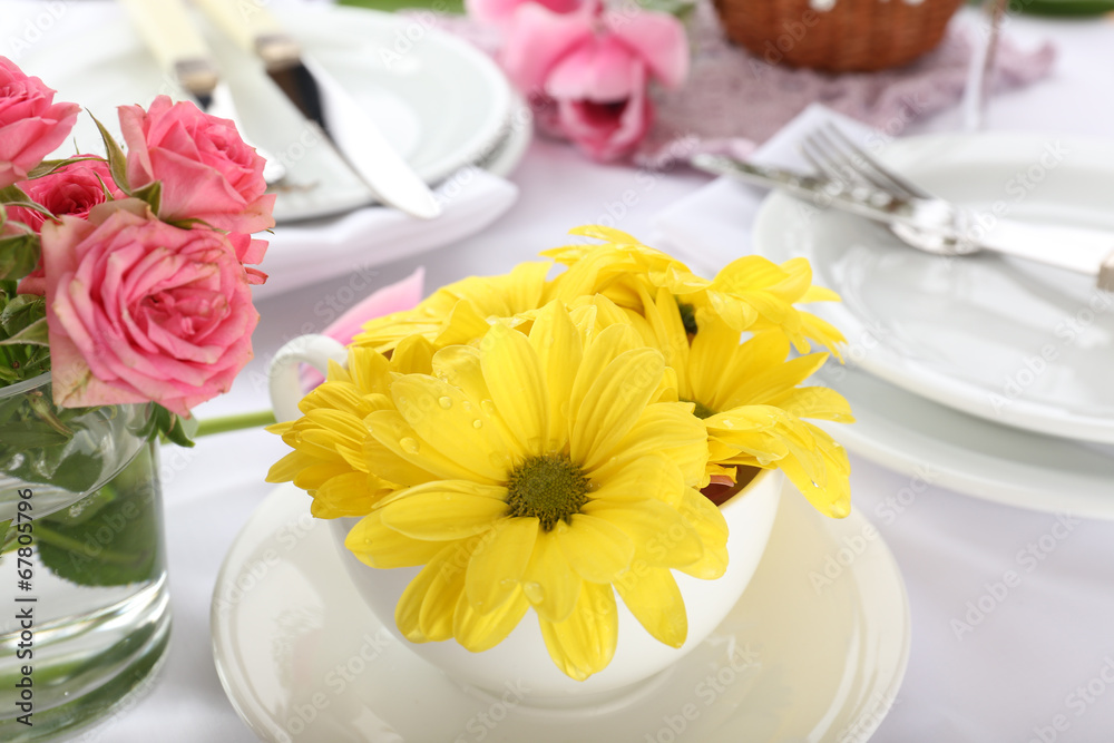 Table setting with spring flowers close up