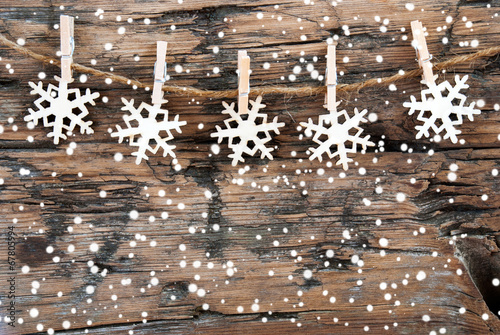 Snowflakes on Wood on Line photo
