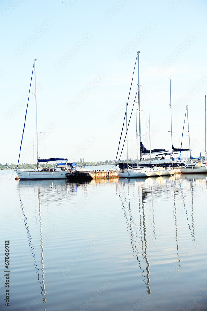 Yachts standing at lake pier