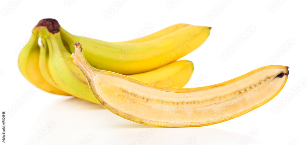 Halved and whole ripe bananas isolated on white