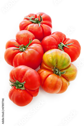 fresh tomatoes over white background.