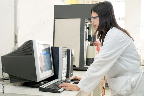 Scientist works at computer scientific analysing data out scient © ake1150
