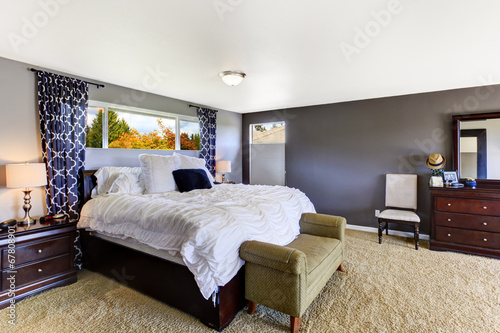 Cozy bedroom interior in soft purple color photo