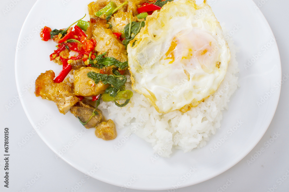 Fried basil leave with crisp pork on rice and fried egg Fried basil leave with crisp pork on rice and fried egg